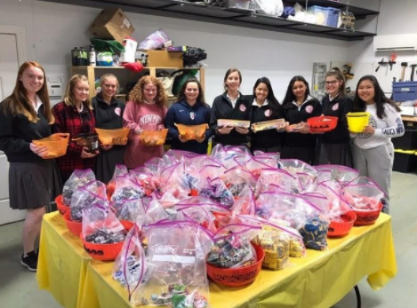 Charity Through Medicine Club members sorting candy to donate to hospitalized kids
